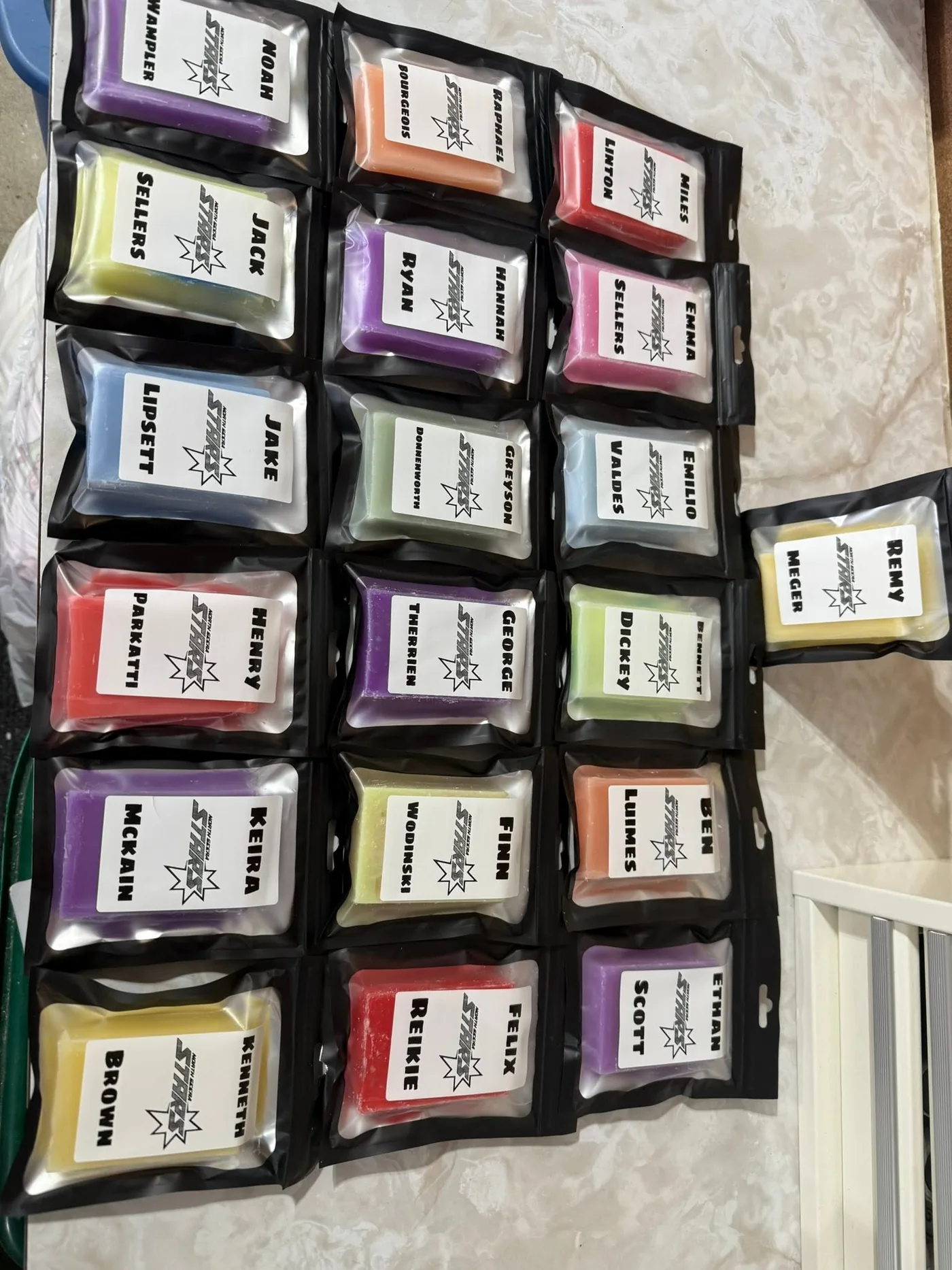 A tray of stick wax, bagged and labelled with every player on the Menace