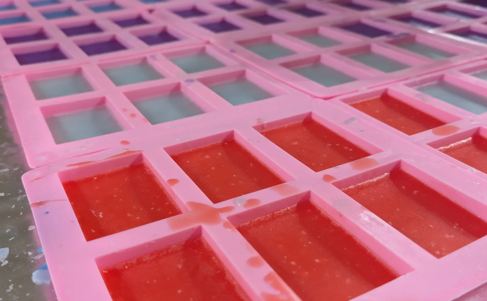 Trays of stick wax setting in their moulds